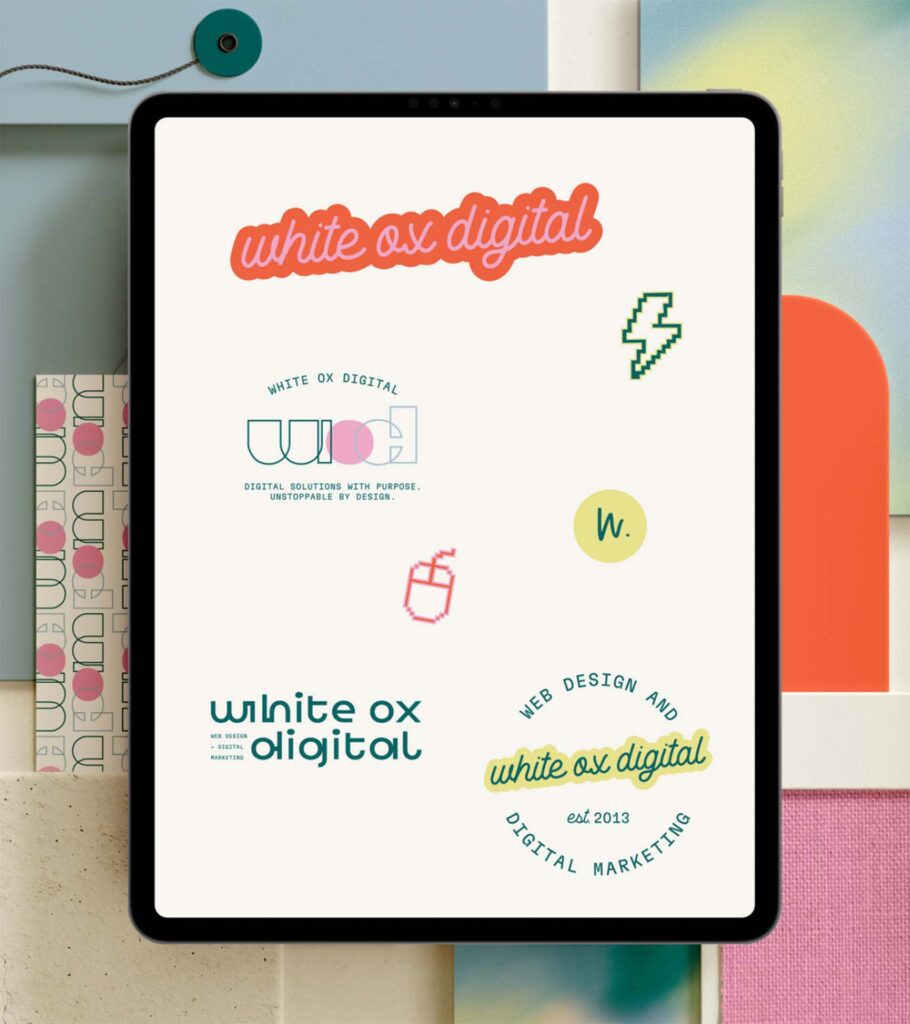 White Ox Digital rebrand logo concepts displayed on a tablet web design and digital marketing agency in Noblesville, IN, established 2013